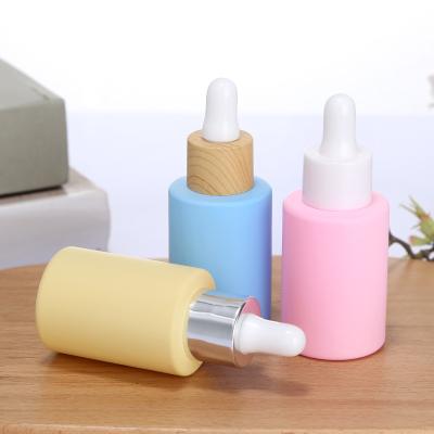 China Eco-friendly Colored White Black Cosmetic Essential Glasses 1 Oz Oil Dropper Glass Bottles With Dropper for sale