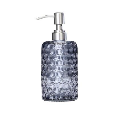 China Cosmetic Creative Round Glass Press Honeycomb Supplies Wash Bottle And Cosmetic Packing Bottle for sale