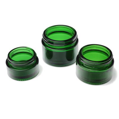 China High Grade Green Shading Glass Cosmetic Cream Jar And Cosmetic Packaging Containers With White Caps for sale