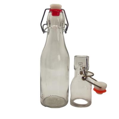 China 1000ml 1L Beverage Colored Ceramic Swing Top Recycled Glass Bottles With Corks for sale