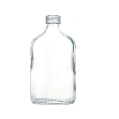 China Various Storage Capacity Transparent Square Glass Beverage Bottle With Aluminum Cap And Customized Label for sale