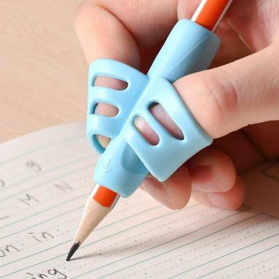 China Universal Writing Correction Posture Multifunctional Desk Table Organizer Silicone Pen Grip Training for Kids for sale