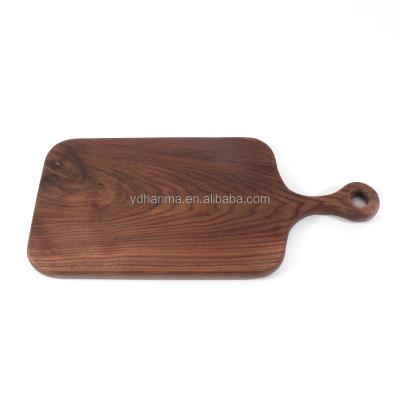 China Disposable Handcrafted Solid Wood Charcuterie Appetizer Table Black Walnut Fruit Vegetables Cutting Serving Board for sale