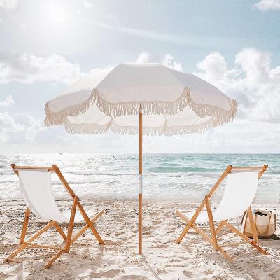 China Modern Custom Luxury Aluminum Beach Chair With Wooden Pole Fringed Beach Parasol Umbrella Cotton Tassels for sale