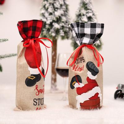 China Creative Red Plaid Fabric Black Plaid Burlap Wine Bag Santa Climbing Chimney Pattern Christmas Wine Bottle Covers Christmas Decoration for sale