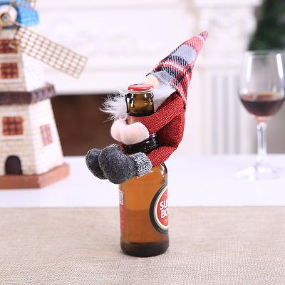 China Christmas Santa Doll Holding Red Wine Faceless Cloth Covers Christmas Bottle Decoration Dinner Table Decor Home New Year Gift 2021 for sale