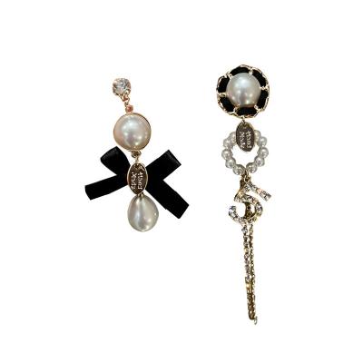 China The Other Fashion Personality Diamond Studded Number Pearl Bow Earrings 2022 Asymmetrical Design Earring Long for sale