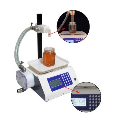 China Semi-automatic Food Filling Machine Honey Bee Products Hand Sanitizer Viscous Filler Liquid Weighing Liquid Filling Machine for sale