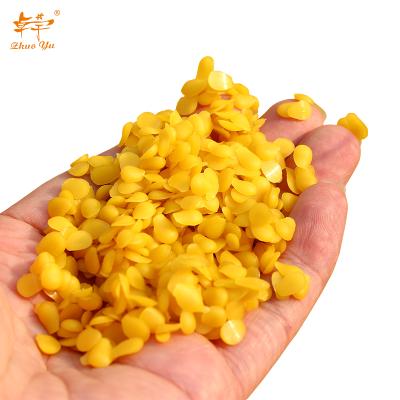 China Pure Natural Raw Beeswax Food/Cosmetic/Candle/Yellow Beeswax Refining Block/Pellet for sale