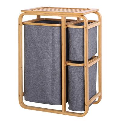 China Laundry Hamper With Shelf Home Laundry Hamper Basket With Shelf Bamboo Frame Removable Tissue Bag Storage Rack for sale