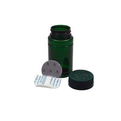 China Manufacturer 100ml Green PET Pill Packer Packaging Bottle With Desiccants Pharmaceutical / Food Grade With Child Resistant Cap for sale