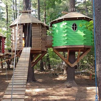 China Parts Amusement Park Playground Steel And Wood Treetops Adventure Camping Artificial Treehouse for sale