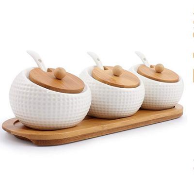 China Freshness Preserving Gridding Tilted White Bulk Custom Wooden Lamella Lids Ceramic Kitchen Spice Canister With Spoon for sale