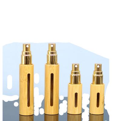 China Cosmetic Gold Plating 5ML 10ML Gold Perfume Refillable Glass Spray Bottle Bamboo Cap for sale