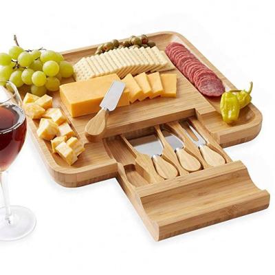 China Eco-Friendly Sustainable Kitchen Bamboo Cheese Board With 4 Knife Set for sale