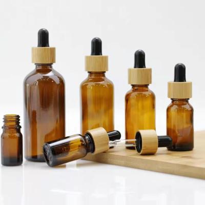 China Personal Care Factory Direct Amber Glass Dropper Bottle Essential Oil Bottle With Bamboo Dropper for sale