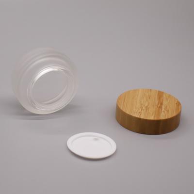 China 5g 15g best selling cosmetic bamboo glass cap cosmetic cream frosted jar for packaging for sale