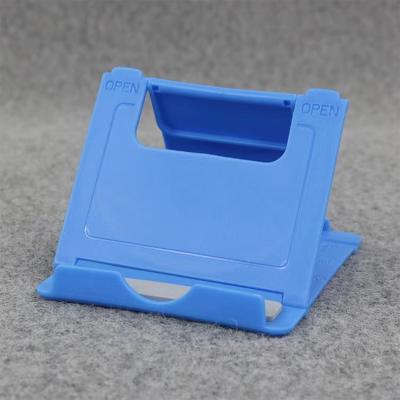 China Mini Folding Lazy Desktop Tablet PC Holder Adjustable Plastic Mobile Phone Holder for sale