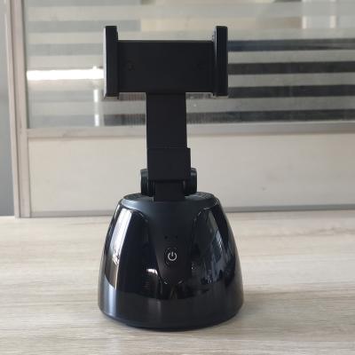 China Smart Adjustable 360 ​​Rotation After Shooting Robot Auto Face Object Cameraman Tracking Phone Camera Holder for sale