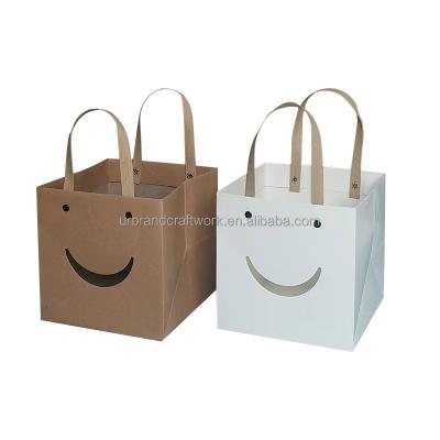 China New Material Design Creative Clear Window Recycled Smile Gift Box Cake Dessert Gift Bag Flower Face Gift Bag Wrapping Paper Bag for sale