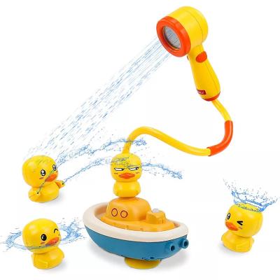 China Bathing Toys Xinmei Toys Summer Fun Whole Sale Yellow Duck Sprinklers Shower Toy High Quality Bath Tub Water Sprayer Toys For Kids for sale