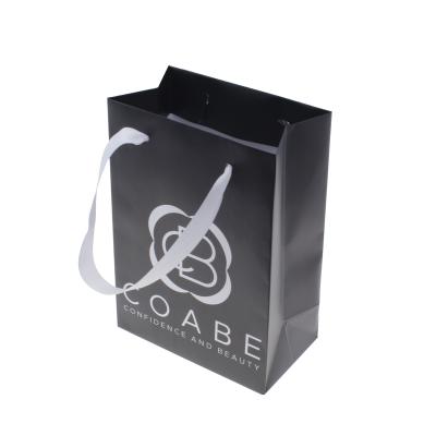 China Recyclable Wholesale Custom Printed Black Luxury Shopping Paper Gift Bag With Handle for sale