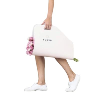 China Recycled Materials Eco-friendly Flower Carry Paper Bag Flower Paper Packaging Carrier Bag With Handle for sale