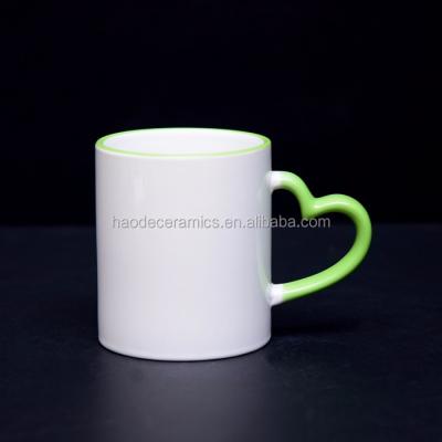 China 11oz Sublimation Viable White Mug With Heart Shape Color Handle Rim For Magic Mug for sale