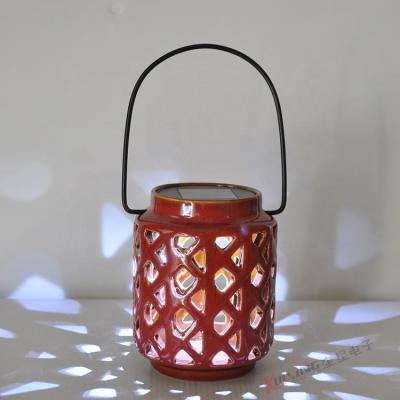 China CA2437 Ceramic Outdoor Garden Lantern Pot LED Solar Powered Hanging White Garden Candle Light Decoration for sale