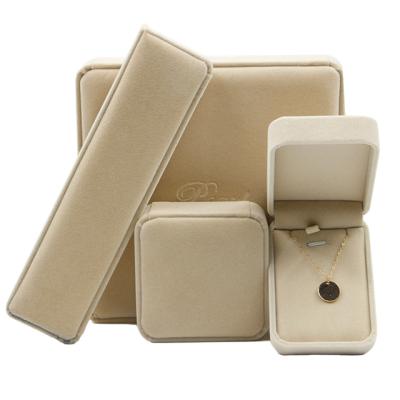 China Jewelry Packaging Beige Color Round Corner Jewelry Velvet Jewelry Gift Box Velvet Ring Box Custom Wholesale Plastic Case for sale