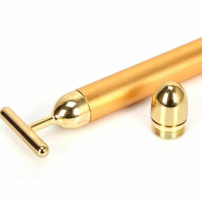 China Portable/Battery/Lovely T Shape Vibrating Facial Massager 24k Gold Face Lifting Anti Wrinkle Roller Energy Beauty Bar for sale