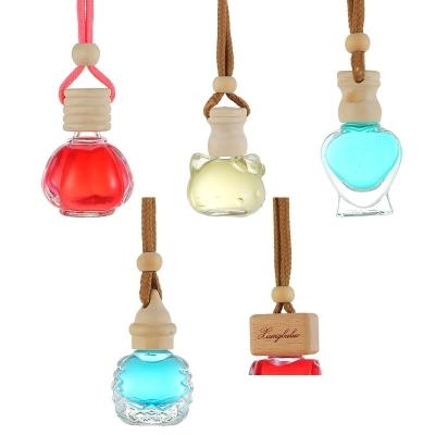 China Contemporary Glass Perfume Bottle Heart Cat Shape Empty Transparent Bottles Car Hanging Hanging Ornament Empty Cosmetic Container for sale