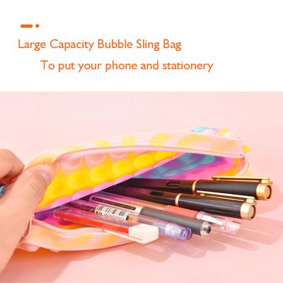 China Fashionable multi use zipper lock silicone bubble popit wiggle pencil box sensory cross - body kids school bag shoulder sling mobile phone bag for sale