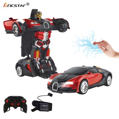 China Bricstar New Arrival 1/14 RC Model One Button Gesture Feeling Deformation Watch Control Stunt rc robot toy with remote control for sale