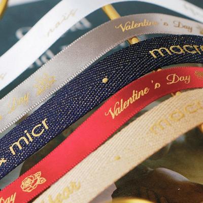 China Stylish Design Polyester Ribbon With Custom Printed Gold Logo Ribbon MSD Ribbon for sale