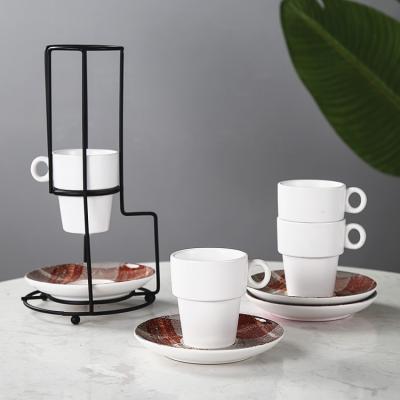 China Viable Wholesale Vintage Matte Tea Cups And Saucers Espresso Ceramic Stackable Coffee Mug Set With Metal Stand for sale