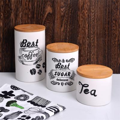 China Airtight Storage Jar Coffee Tea Steamable Home Decor Ceramic Food Kitchen Storage Canister Set With Wooden Cover for sale