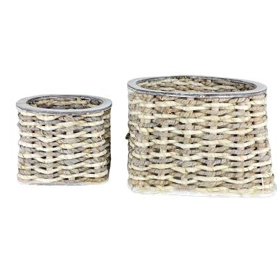 China 2021 best-selling modern Nordic style flower pot small round woven and wooden basket with waterproof lining for sale