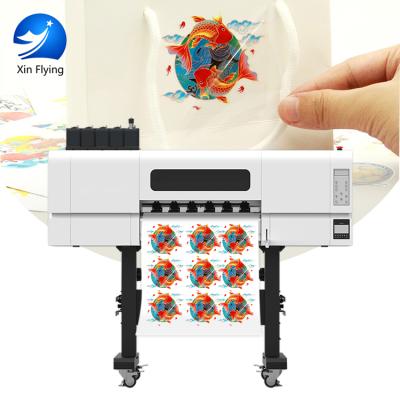 中国 UV with varnish UV DTF printer with free software for printing Bottle pen phone case 販売のため