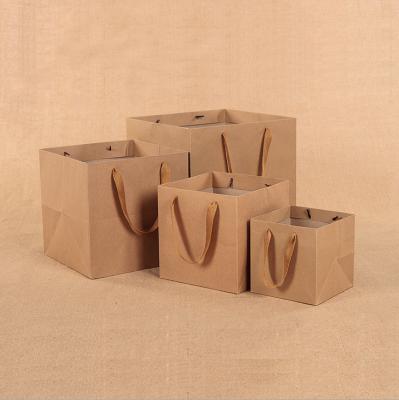 China 2020 Wholesale High Quality Simple Recycled Recycled Paper Shopping Gift Wrapping Recyclable Kraft Carry Bag Custom Brown With Cotton Handle Porcelain for sale