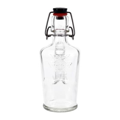 China 150ml Beverage Brew Beer Home Clear Glass Swing Top Bottle With Flip Top Caps Glass Bottle for sale