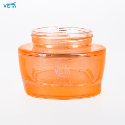 China 60ml 100ml cosmetic cosmetic glass spraying orange color bottles face cream essential oil bottle with screw head for sale