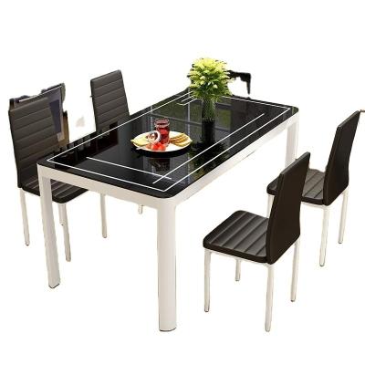 China Modern minimalist dining table 4 people dining table and chair combination family small 6 people rectangular tempered glasss for sale