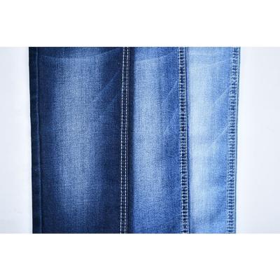 China GV332 new cotton dual core dualfx denim fabric indigo color shade breathable competitive high quality jeans fabric for sale