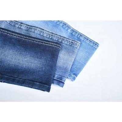 China GV329 breathable 12 oz denim fabric for jeans material with warp woven jeans fabric manufacturers in Foshan China for sale