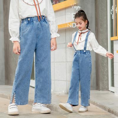 China 2022 spring fashion strap casual pants beaded kids boutique jeans girls denim solid color jumpsuits pants for sale