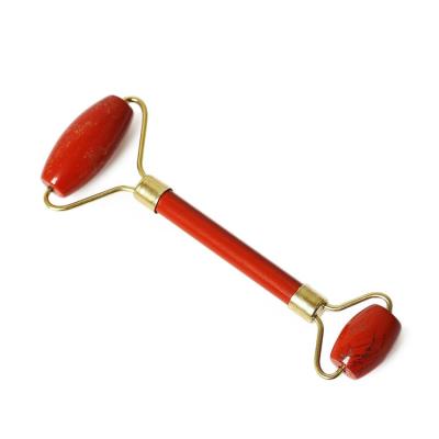 China 100% Natural Jade Facial Stone Facial SPA Red Jasper Stone Roller Healing Anti Aging Tool for sale