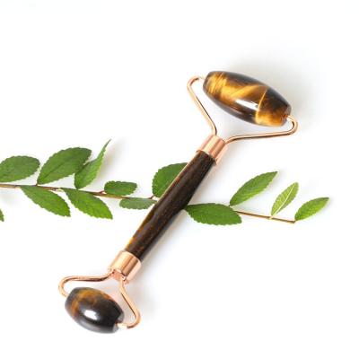 China 100% Natural Tiger Eye Stone Roller Massager Jade Anti Aging Rose Gold Metal Tool for sale