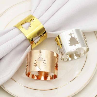 China Christmas Tree Gold Wide Round Metal Napkin Rings Hollow Napkin Holder For Wedding Party Table Decoration HWC128 for sale