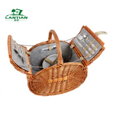 China Africa Custom Design Woven Natural Material Food Gift Storage Basket Weaving With Handles Lid Willow Wicker Oval Picnic Set Basket for sale